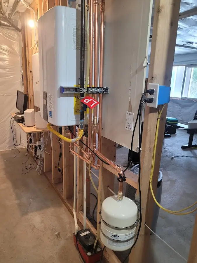 Licensed plumber repairing a kitchen sink in Cinnaminson